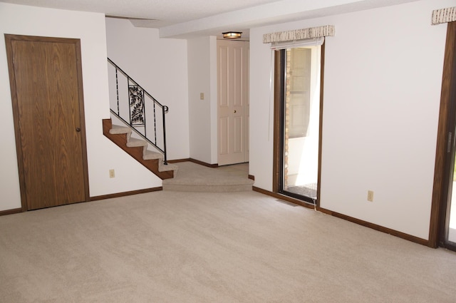 2140 Tamarin Trl, Golden Valley, MN 55427 - unfurnished room with carpet, baseboards, stairs, and healthy amount of natural light