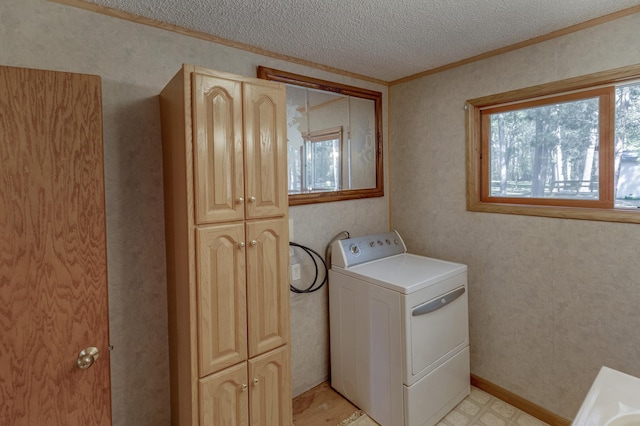 clothes washing area with washer / clothes dryer, cabinet space, crown molding, a textured ceiling, and light floors