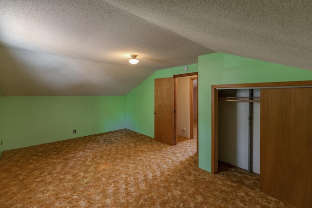 additional living space with vaulted ceiling and carpet