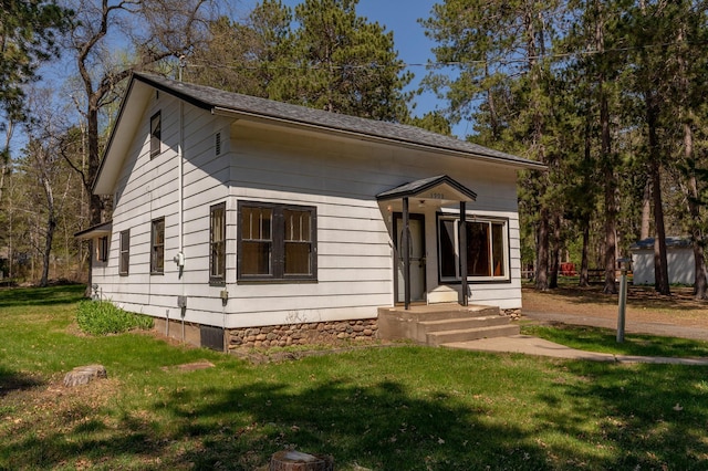 bungalow with a front yard