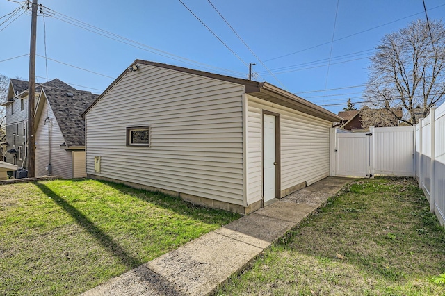view of outbuilding featuring a gate