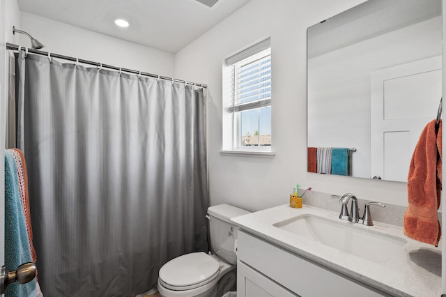 full bathroom with vanity, toilet, a shower with shower curtain, and recessed lighting