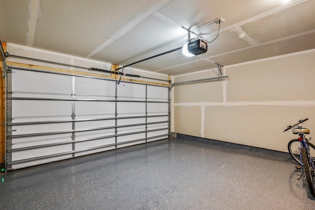 garage featuring a garage door opener