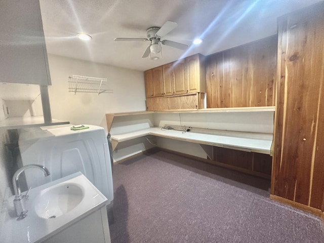 laundry room featuring ceiling fan and a sink
