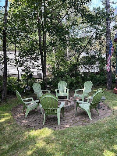 view of yard with a fire pit and a patio