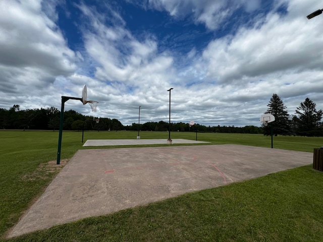 view of sport court with community basketball court and a yard
