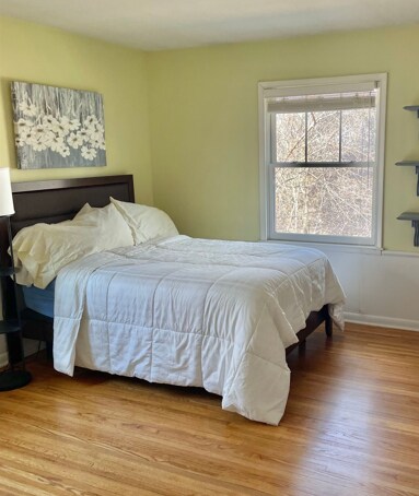 3918 Willmatt Hl, Minnetonka, MN 55305 - bedroom with light wood-style flooring and baseboards