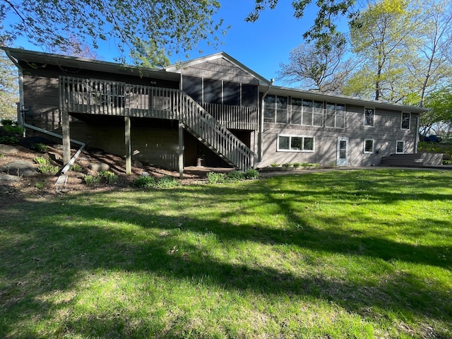 3918 Willmatt Hl, Minnetonka, MN 55305 - rear view of house with a sunroom, a deck, stairs, and a lawn
