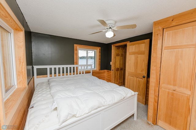 20850 Leona Beach Rd, Erie Twp, MN 56578 - carpeted bedroom with a ceiling fan and a textured ceiling