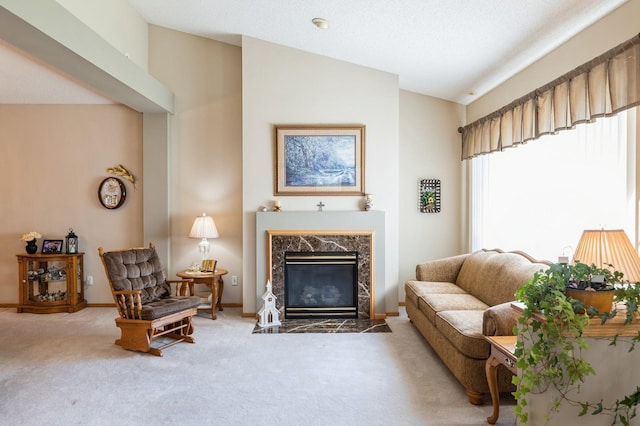 living area with carpet, vaulted ceiling, a premium fireplace, and baseboards