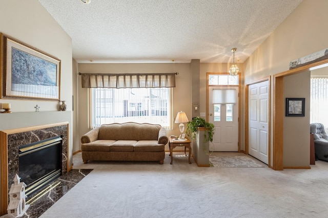 carpeted living area with a textured ceiling and a fireplace