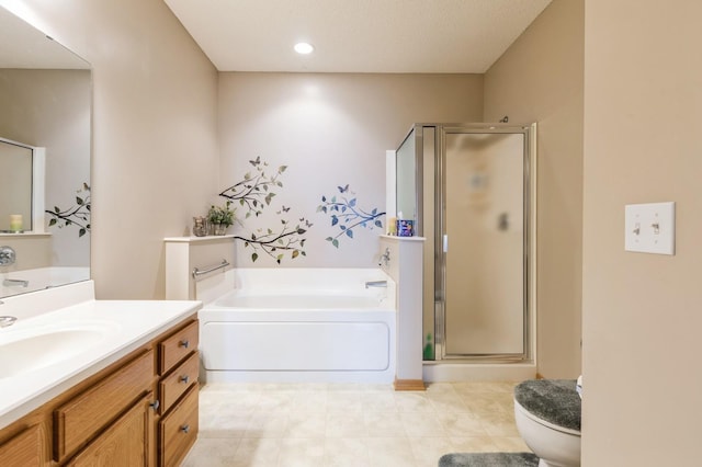 full bathroom with a shower stall, vanity, a garden tub, and toilet