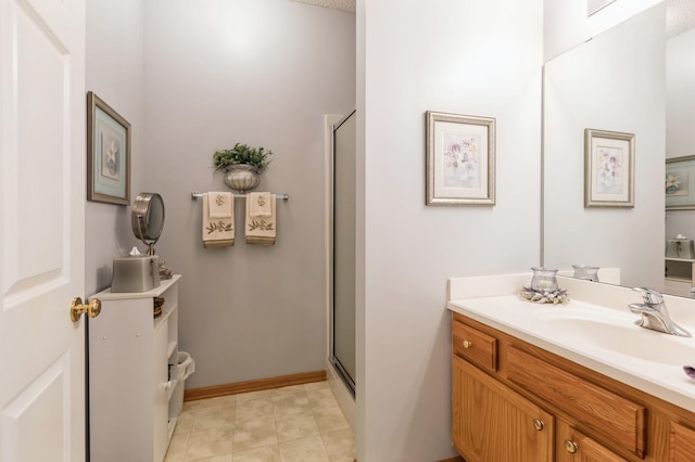 full bathroom featuring a shower stall and vanity