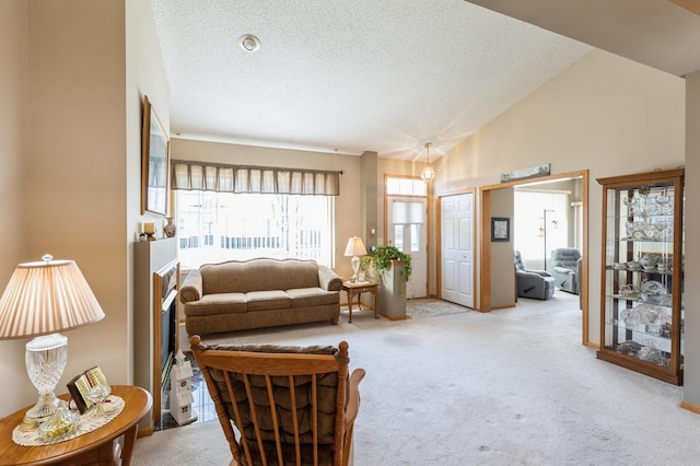 living room featuring light colored carpet, a textured ceiling, and vaulted ceiling