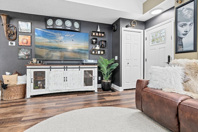 living area featuring wood finished floors and baseboards