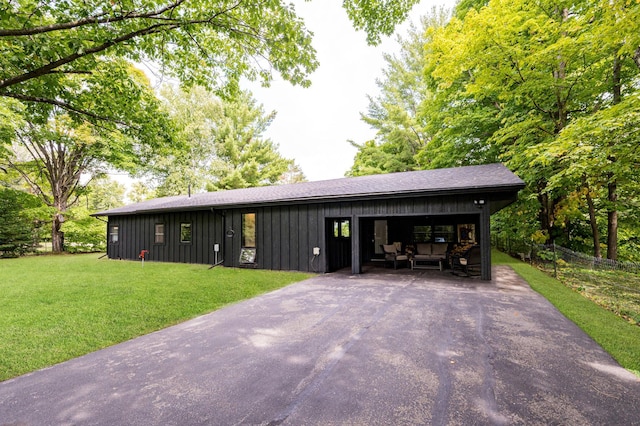 20380 Crystal Springs Loop, Harris Twp, MN 55744 - view of front of property with asphalt driveway and board and batten siding