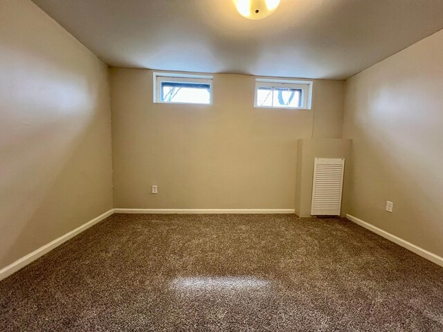 below grade area with carpet floors and baseboards