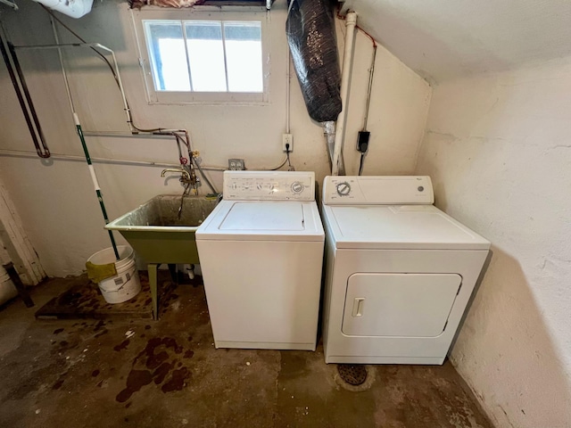 laundry room featuring independent washer and dryer and a sink