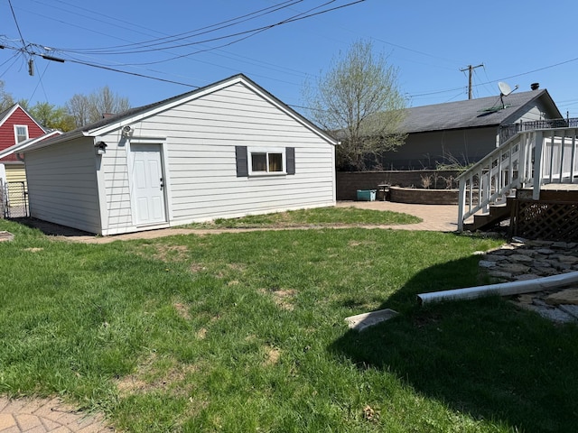 view of property exterior with stairway and a wooden deck