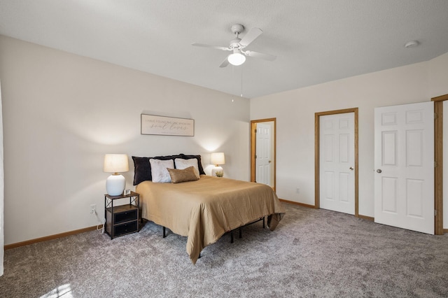 carpeted bedroom featuring baseboards and ceiling fan