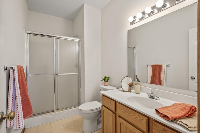 full bath with a stall shower, toilet, and vanity