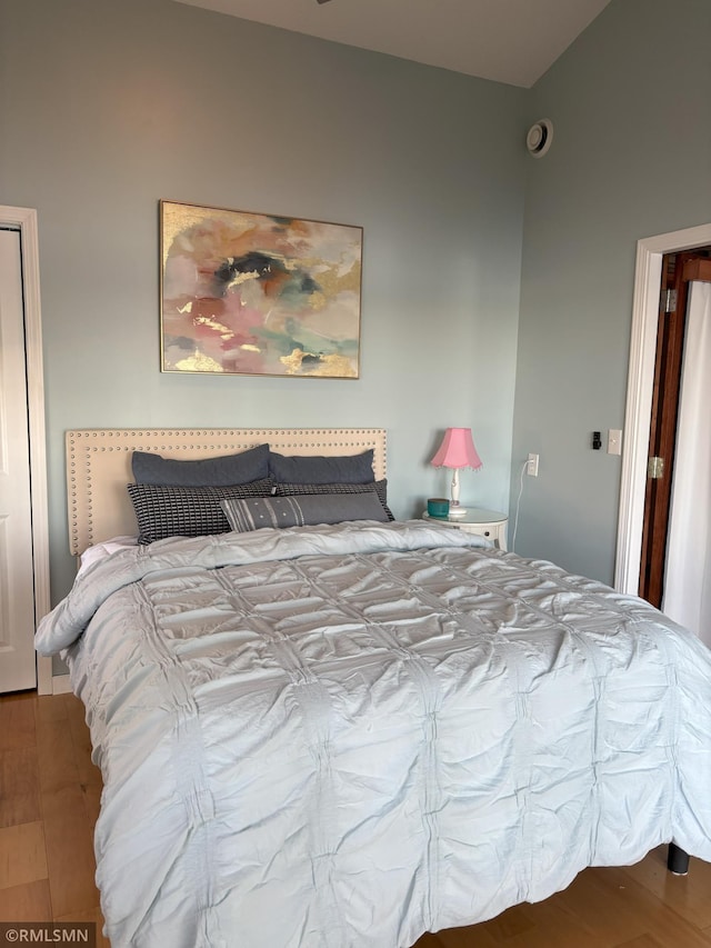 bedroom featuring wood finished floors