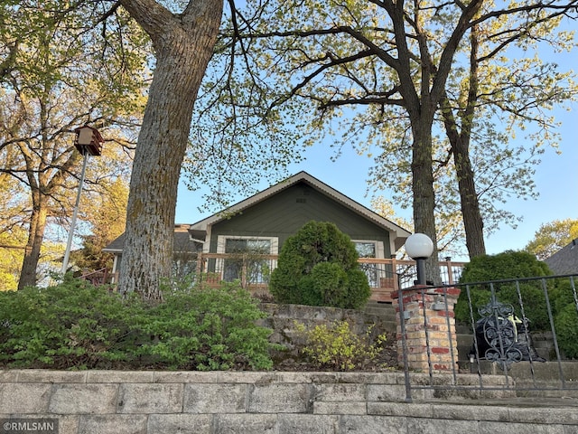 view of side of property with a gate and a fenced front yard