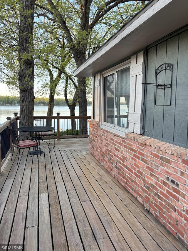 wooden terrace with a water view
