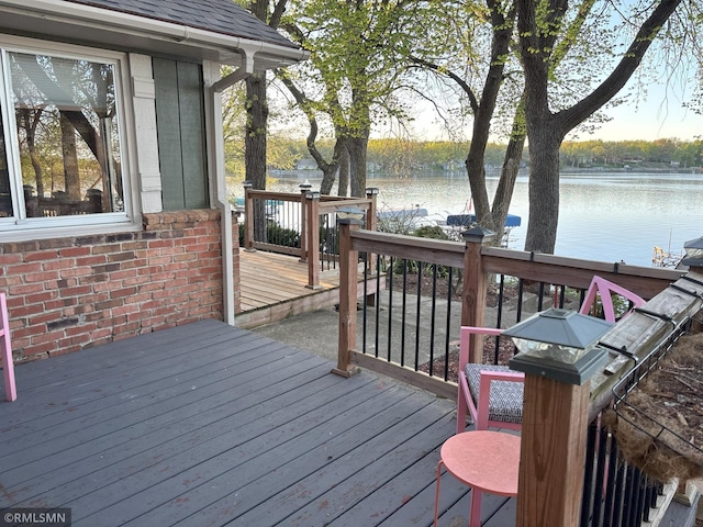 wooden terrace with a water view
