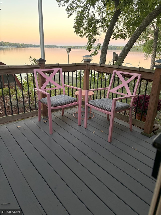 wooden deck featuring a water view