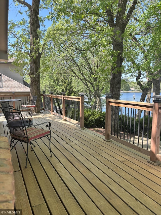 deck featuring a water view