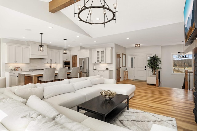 15359 Quamba St NE, Ham Lake, MN 55304 - living area featuring recessed lighting, light wood-style flooring, a chandelier, beamed ceiling, and high vaulted ceiling