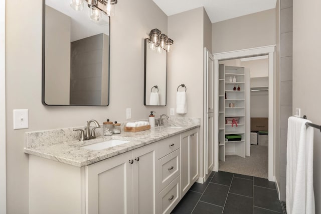 15359 Quamba St NE, Ham Lake, MN 55304 - bathroom featuring tile patterned flooring, double vanity, and a spacious closet