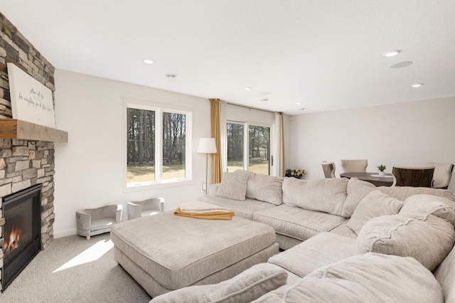 15359 Quamba St NE, Ham Lake, MN 55304 - living area with a stone fireplace, carpet flooring, and recessed lighting