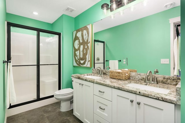 15359 Quamba St NE, Ham Lake, MN 55304 - bathroom with a stall shower, toilet, double vanity, and tile patterned floors