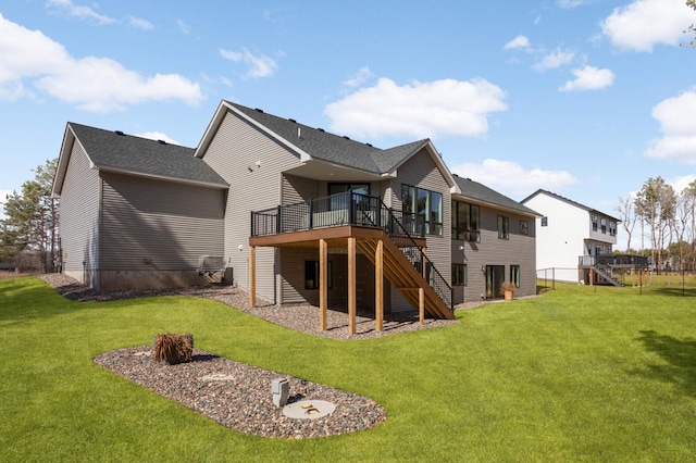 15359 Quamba St NE, Ham Lake, MN 55304 - back of property with stairs, a deck, a lawn, and roof with shingles