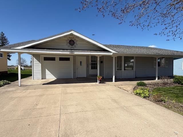 421 Main St E, Eitzen, MN 55931 - ranch-style house featuring driveway, an attached garage, and a porch