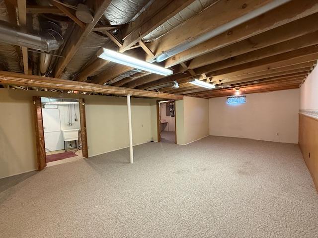 421 Main St E, Eitzen, MN 55931 - finished basement featuring a sink and light carpet