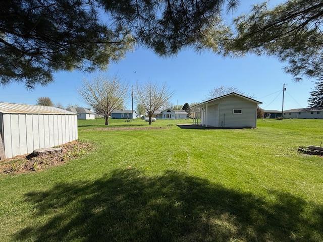 421 Main St E, Eitzen, MN 55931 - view of grassy yard featuring an outbuilding