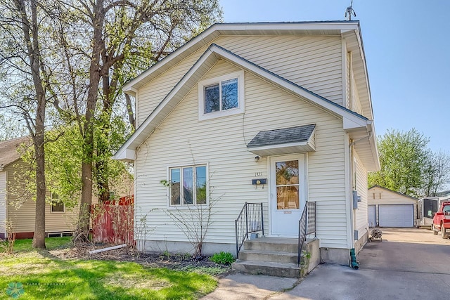 view of front of house featuring an outbuilding and a detached garage