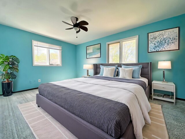 4806 Monroe St NE, Columbia Heights, MN 55421 - bedroom with multiple windows, baseboards, and a ceiling fan