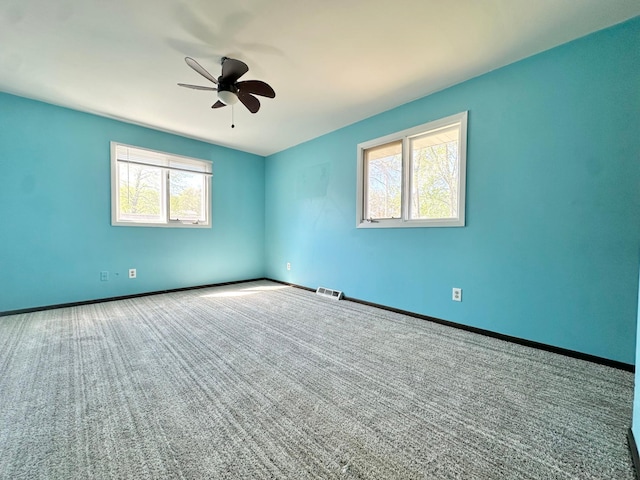 4806 Monroe St NE, Columbia Heights, MN 55421 - carpeted spare room with ceiling fan and baseboards