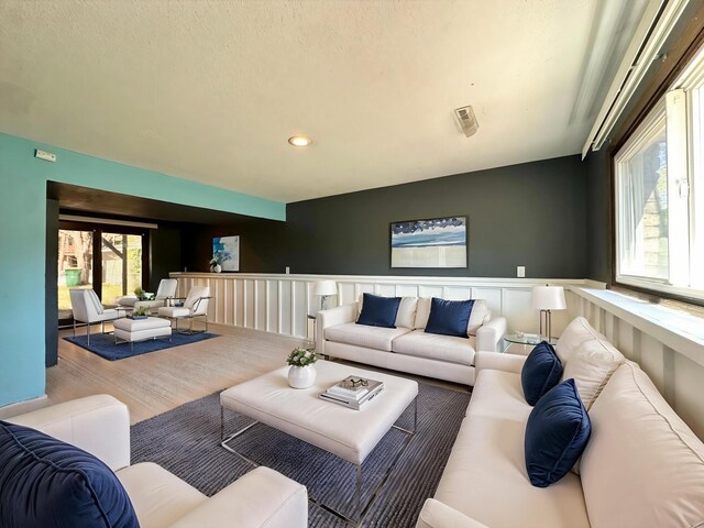 4806 Monroe St NE, Columbia Heights, MN 55421 - living area featuring wood finished floors, recessed lighting, and wainscoting