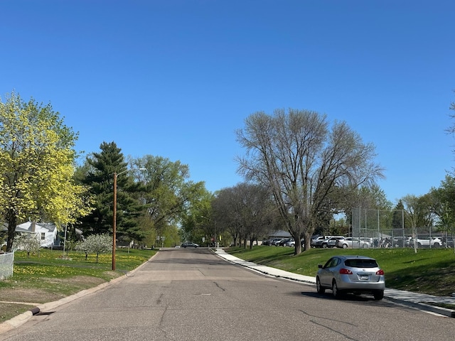 4806 Monroe St NE, Columbia Heights, MN 55421 - view of asphalt street with curbs, street lighting, and sidewalks