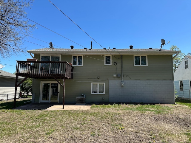 4806 Monroe St NE, Columbia Heights, MN 55421 - rear view of house featuring a wooden deck, a patio area, and cooling unit