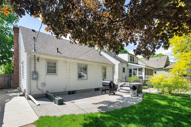 5341 Knox Ave S, Minneapolis, MN 55419 - rear view of house with roof with shingles, a chimney, a patio, a sunroom, and a gate