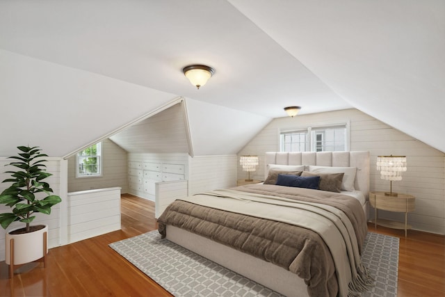 5341 Knox Ave S, Minneapolis, MN 55419 - bedroom featuring wooden walls, wood finished floors, and vaulted ceiling