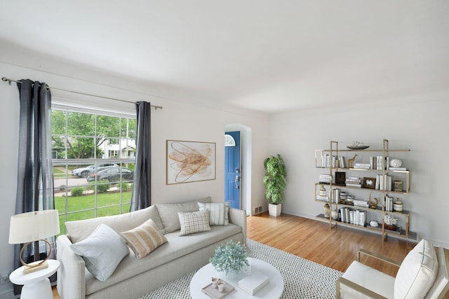 5341 Knox Ave S, Minneapolis, MN 55419 - living room with arched walkways, wood finished floors, and baseboards