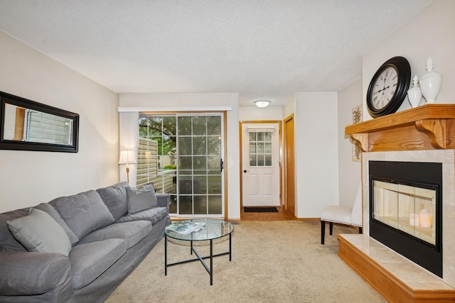 13210 Meadowood Trl NW Unit 63Nw, Coon Rapids, MN 55448 - carpeted living room with a tile fireplace and a textured ceiling