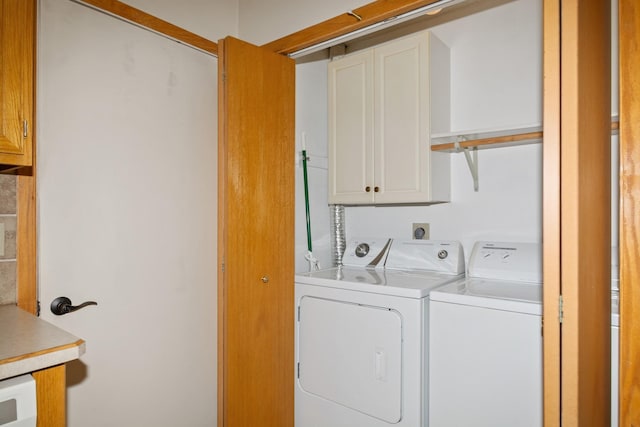 13210 Meadowood Trl NW Unit 63Nw, Coon Rapids, MN 55448 - washroom with cabinet space and washing machine and clothes dryer